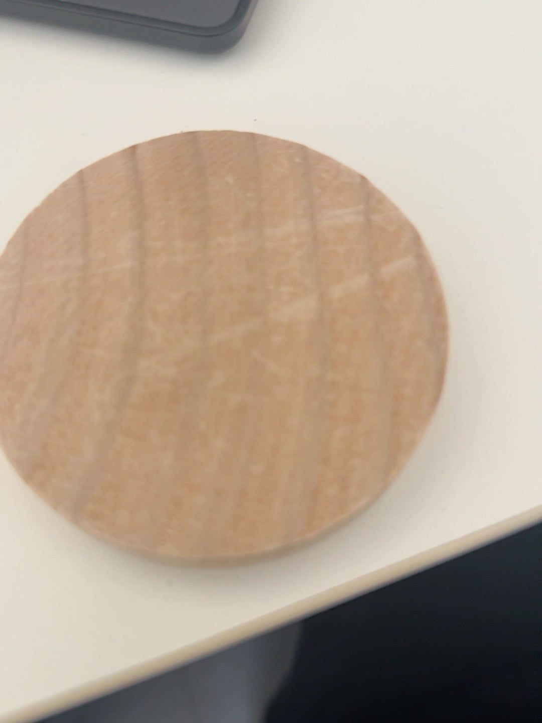 Blank natural wood round before engraving