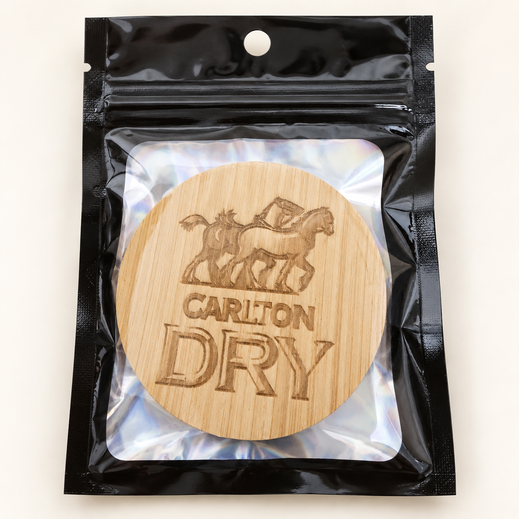 Carlton Dry engraved wooden bottle opener in retail pouch on clean background