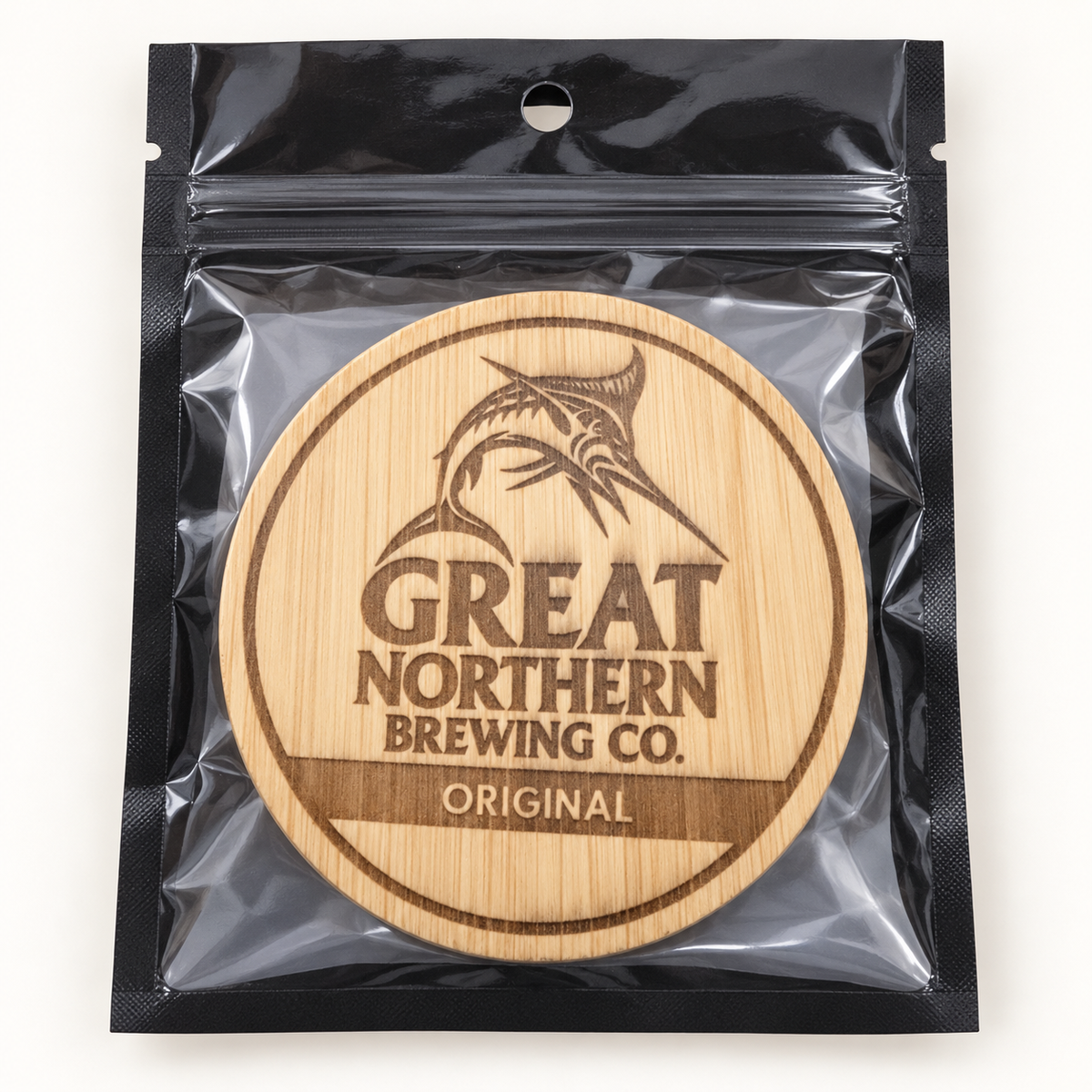 Great Northern engraved wooden bottle opener in retail pouch on clean background