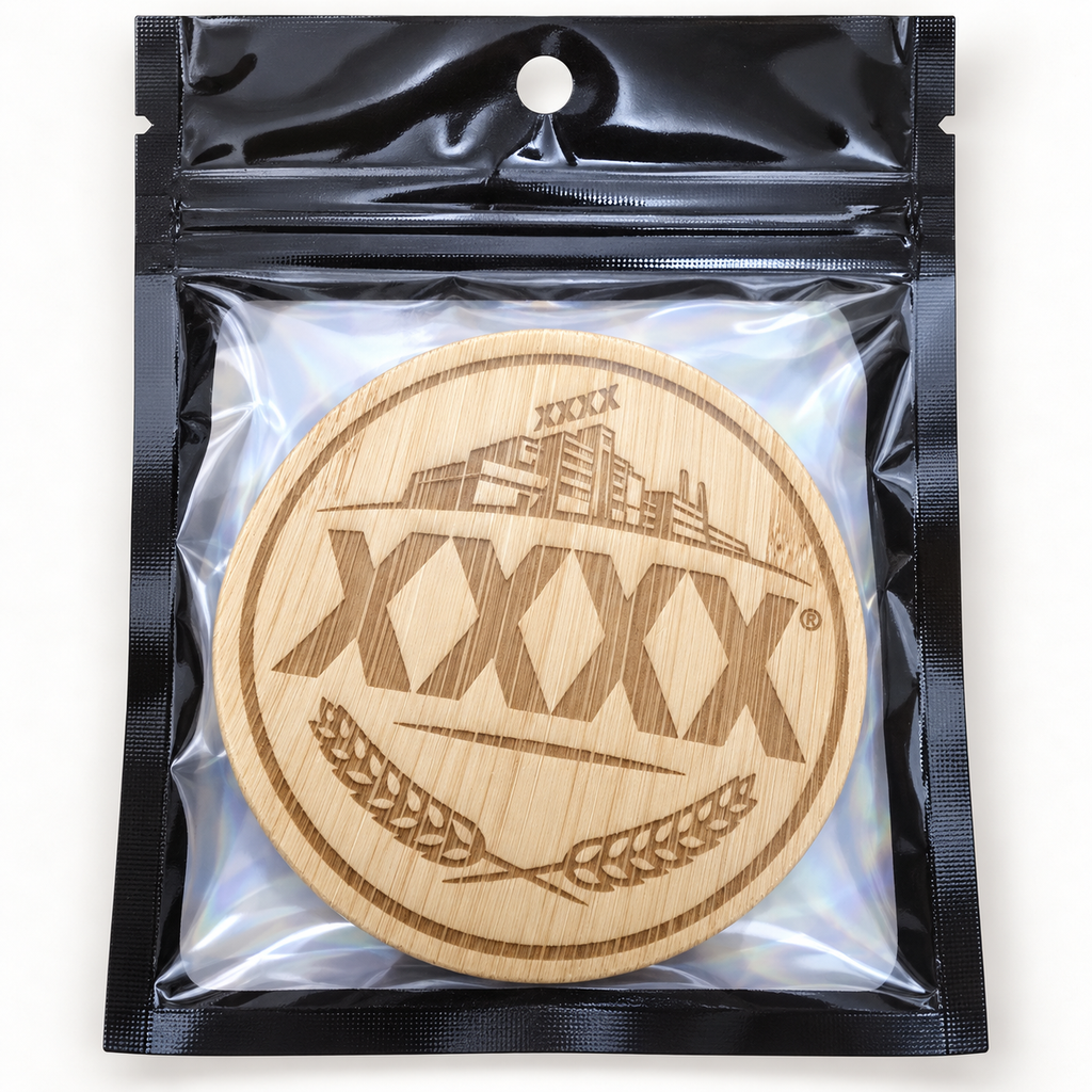 XXXX engraved wooden bottle opener in retail pouch on clean background