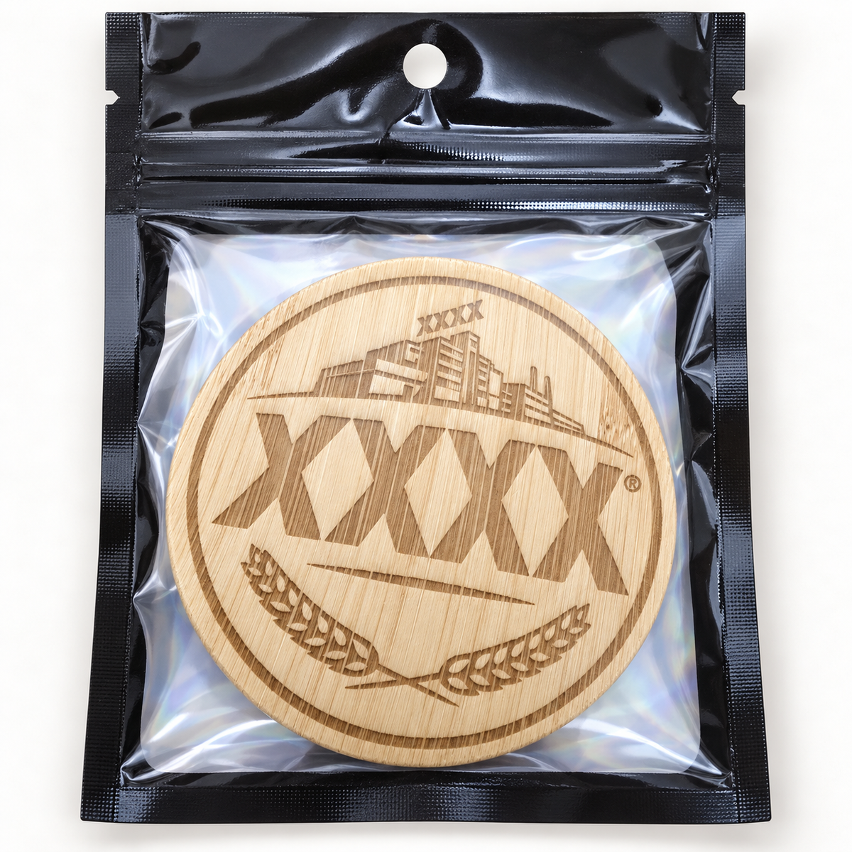 XXXX engraved wooden bottle opener in retail pouch on clean background